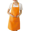 An orange oil-proof cooking apron worn by a person.