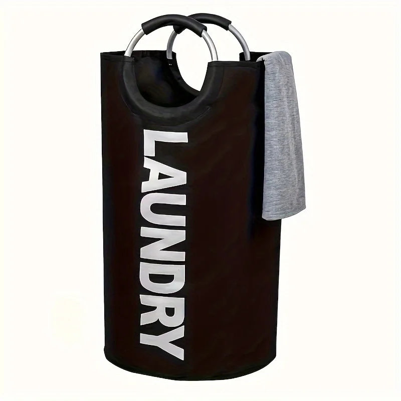 A dark brown waterproof laundry basket with a padded handle and a gray towel hanging over the side.