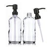 A clear glass soap dispenser set featuring a pump mechanism with black and white components.