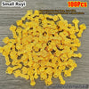 A pile of 100 small gold bar decorative ornaments, approximately 2cm long and 1cm wide.