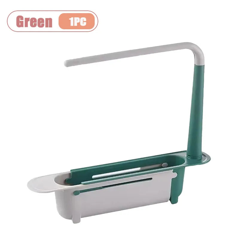 A green adjustable over-sink dish rack organizer with a white handle and tray.