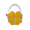 Silver foldable handbag hook with a yellow flower design.