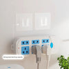 White electrical outlet with two wall hooks installed, showing strong load-bearing capacity.