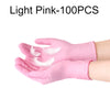 Light pink disposable nitrile gloves shown on a hand, with white feather details visible.