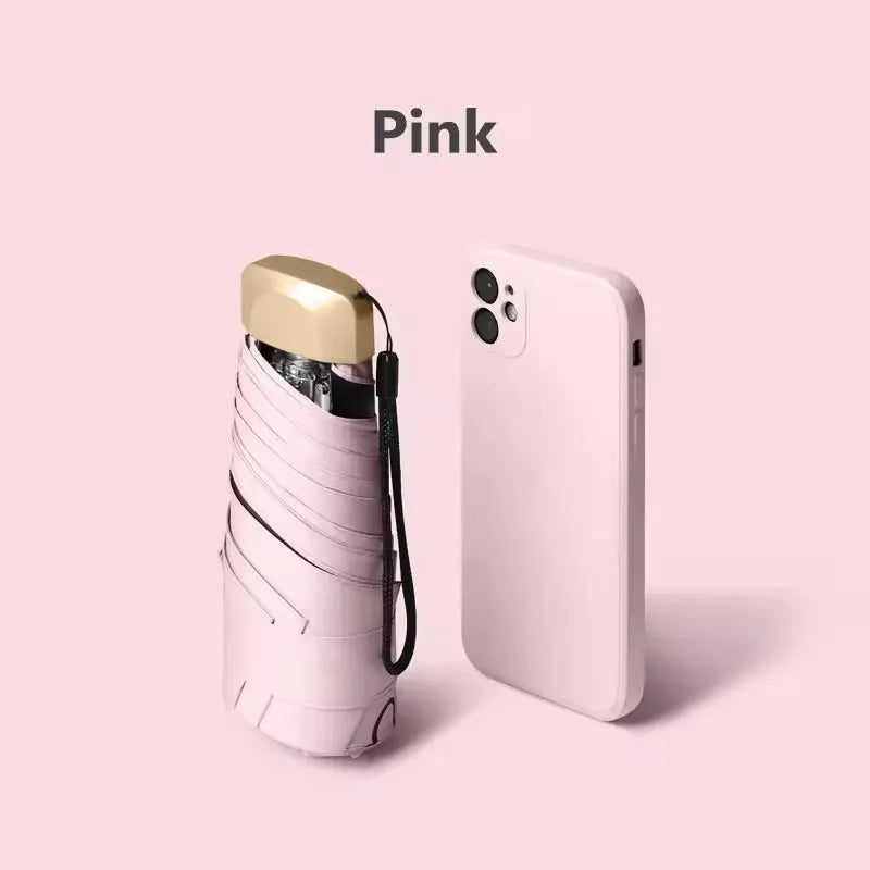 A pink compact folding UV protection umbrella is shown against a light pink background.