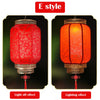 A red Chinese lantern with a textured fabric and metal frame shown in both light off and lighting effects.