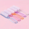 A set of multi-purpose nail art and dust cleaning brushes in various pastel colors on a pink background.
