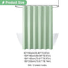 A light green pleated shower curtain hanging on a metal rod.