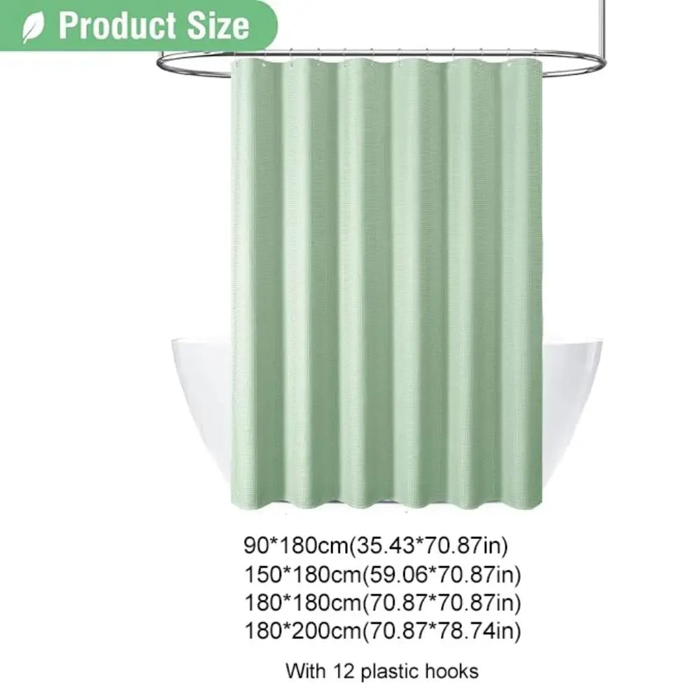 A light green pleated shower curtain hanging on a metal rod.
