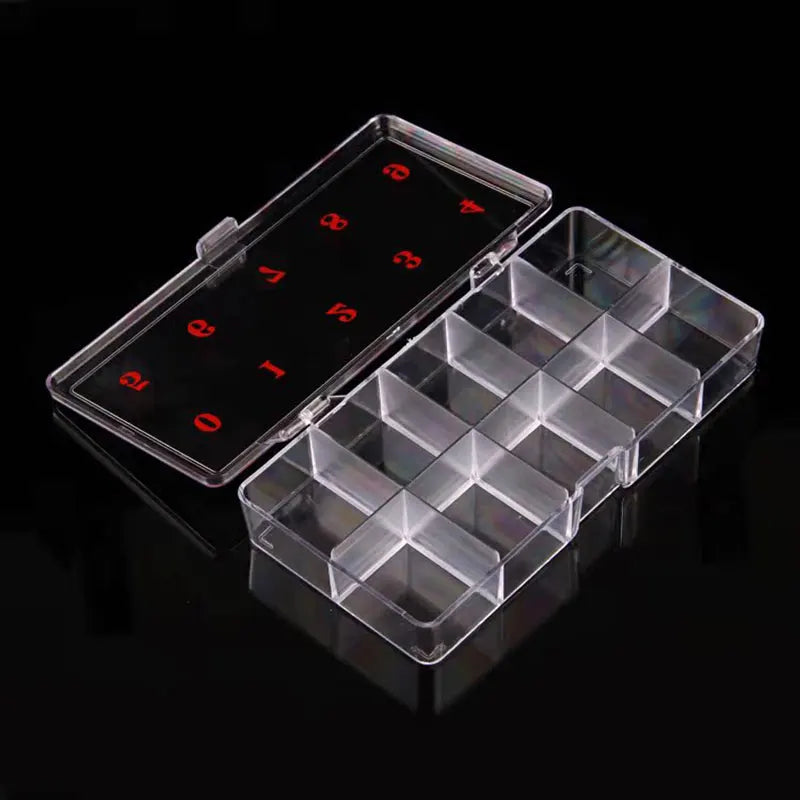 A clear plastic nail art organizer storage box with compartments and numbered slots for organizing nail supplies.