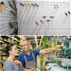 A close-up of heavy-duty mesh grid display hooks with various colored hangers and tools displayed on a white board.