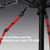 Close-up view of a black umbrella frame with red ribs, demonstrating wind resistance.