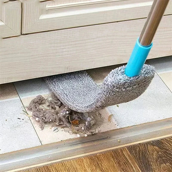 A microfiber duster with a telescopic handle is shown cleaning dust from a window sill.