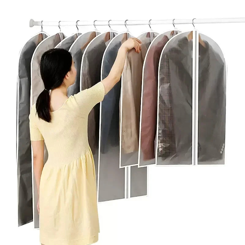 A woman is hanging a garment on a hanger that has a dust cover, showing the fabric and its protective sleeve.