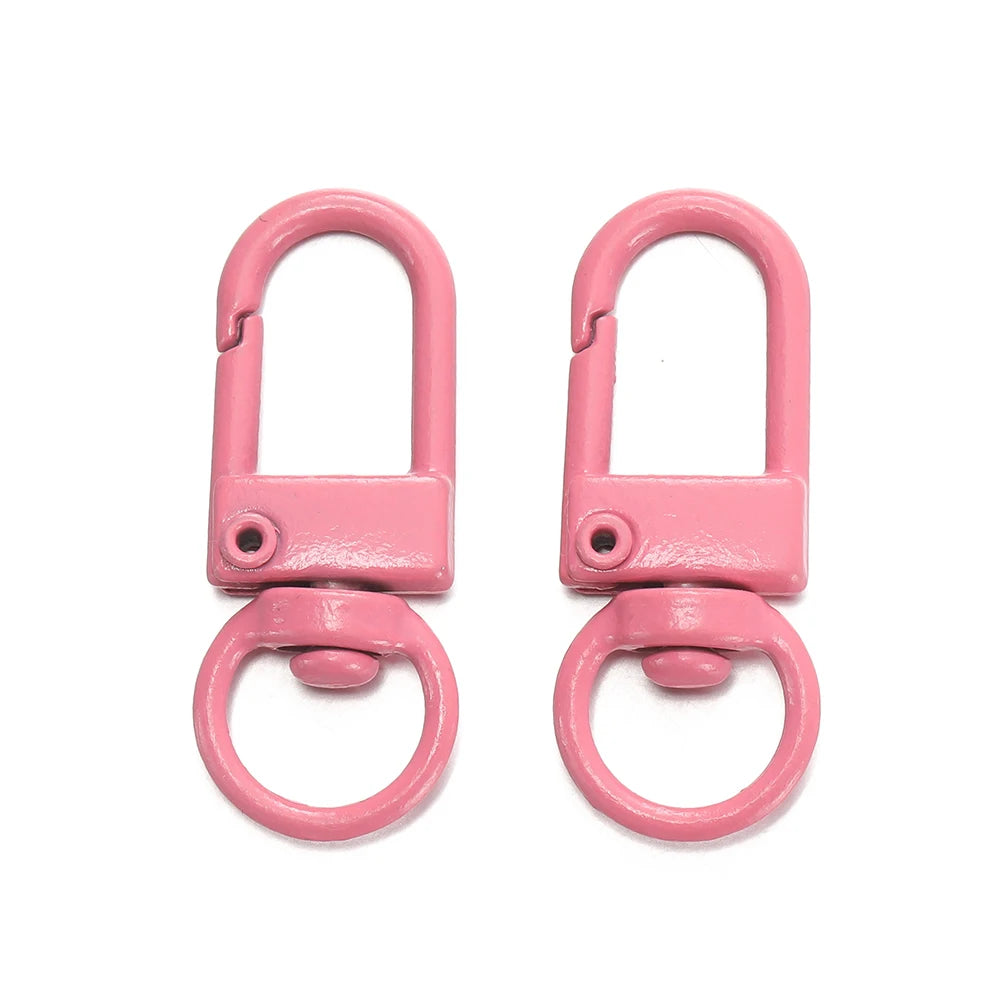 A pair of pink alloy snap lobster clasp hooks for jewelry making