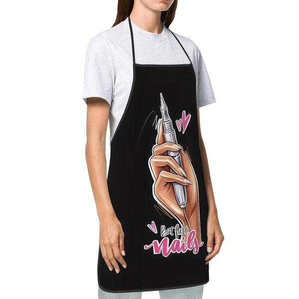 A woman wearing a black apron over a gray t-shirt, featuring a hand painting nails on a finger.
