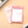 A pink jewelry display pouch with a reflective insert is shown next to a white pouch on a light background.