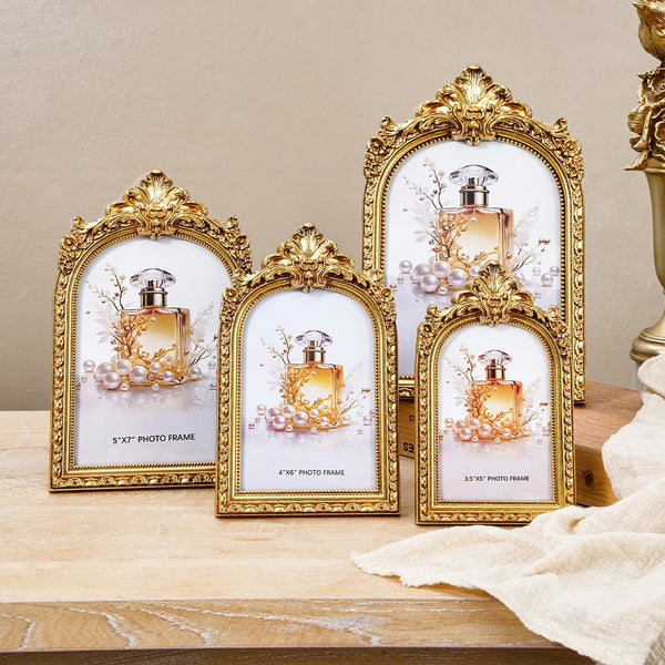A collection of retro golden arch photo frames displaying perfume bottles and pearl accents.