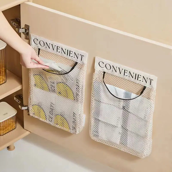 Two white elastic mesh bags labeled convenient are hanging on a kitchen cabinet door.