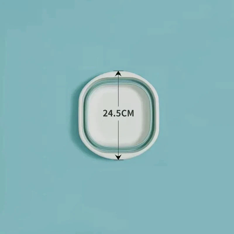 A white foldable plastic wash basin with a diameter of 24.5cm shown against a light blue background.