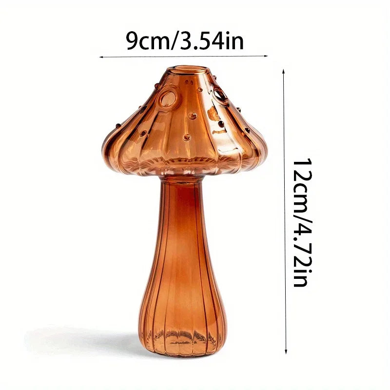 A translucent amber glass mushroom vase with a flared cap and narrow neck, shown against a white background.