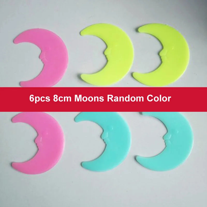 Six 8cm moons in random colors pink yellow and light blue glow in the dark wall decals