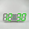 A digital alarm clock displaying 88888888, featuring a silver face and bright green LED digits.