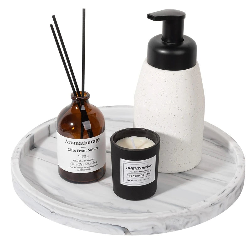 A set of silicone kitchen and bathroom tray organizers displayed on a white marble tray.