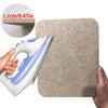 A hand is holding a white and blue ironing mat, demonstrating its thickness with a wooden ruler.