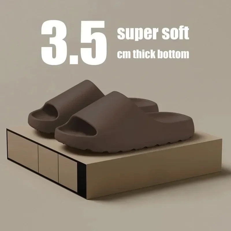 Brown EVA slides with a 3.5 cm thick bottom shown on a wooden surface.