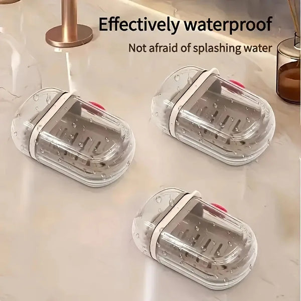 Clear plastic soap box with a sealed lid resting on a white countertop.