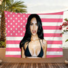 A woman posing in front of a pink and white striped American flag banner.