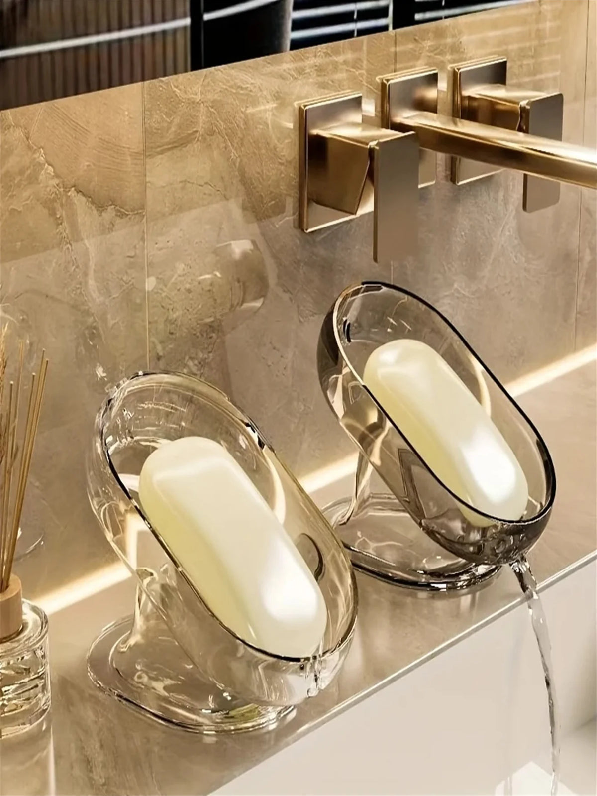 Elegant lightweight glass soap dish with a white bar soap on a modern bathroom countertop.