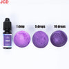A bottle of violet liquid candle dye next to three discs showing different concentrations: 1 drop, 5 drops, and 10 drops.