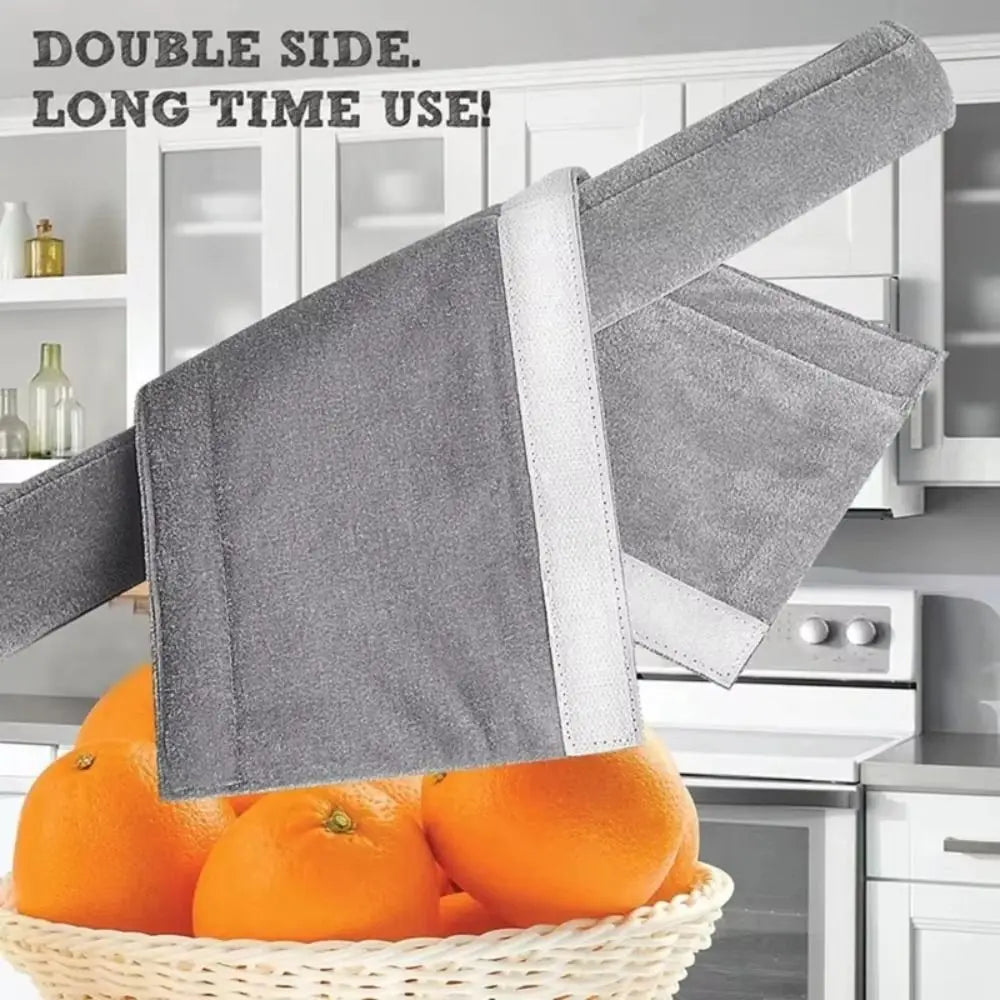 A double-sided silicone handle cover in gray protecting an orange from a basket.