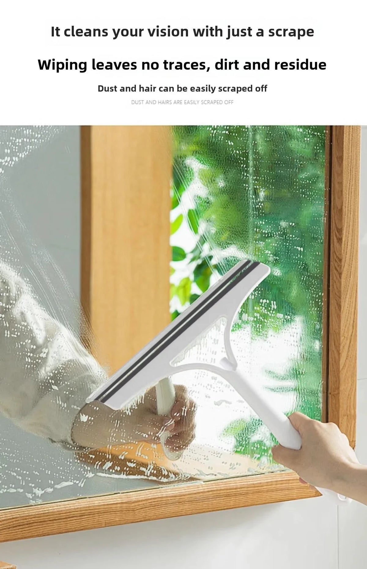 A hand is using a white multi-function glass cleaner and scraper to wipe a window, leaving a clean surface.