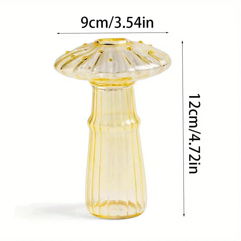 A clear glass mushroom-shaped vase with a flared top and tapered body, measuring 9cm/3.54in tall.