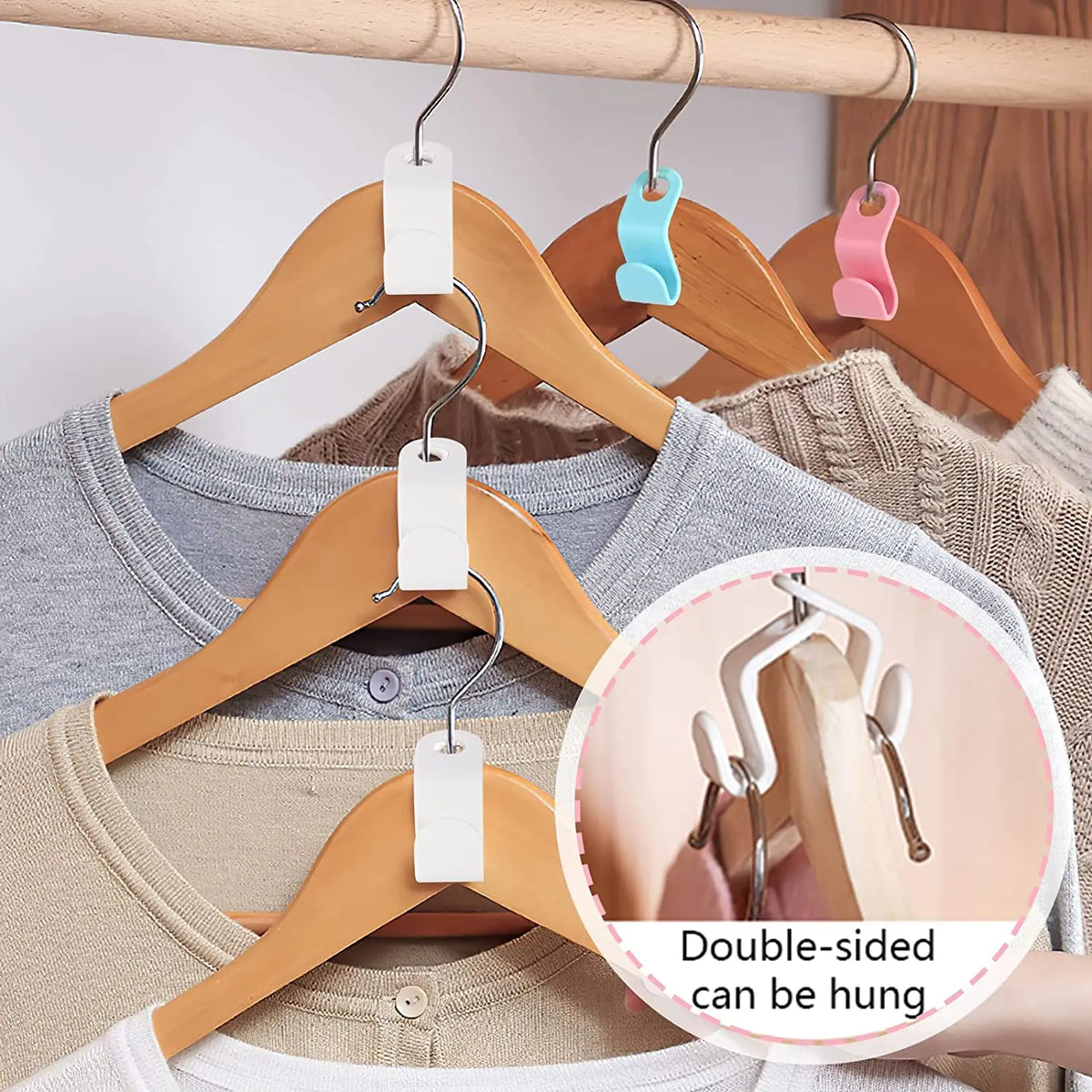 Double-sided hanger connector hooks used for closet organization on a wooden hanger.