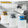 A set of three decorative toilet paper holders featuring owl figures in yellow, gray, and blue on white bases.