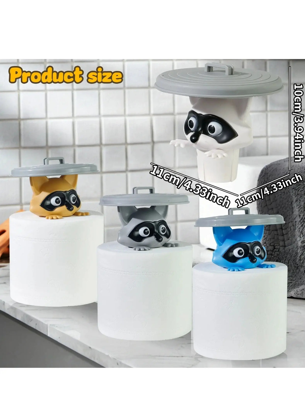A set of three decorative toilet paper holders featuring owl figures in yellow, gray, and blue on white bases.