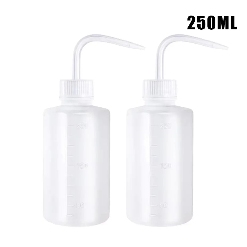 A 2-pack of clear squeeze bottles with measurement marks for tattoo solutions.