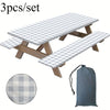 A set of three plaid checkered tablecloths or mats for outdoor use.