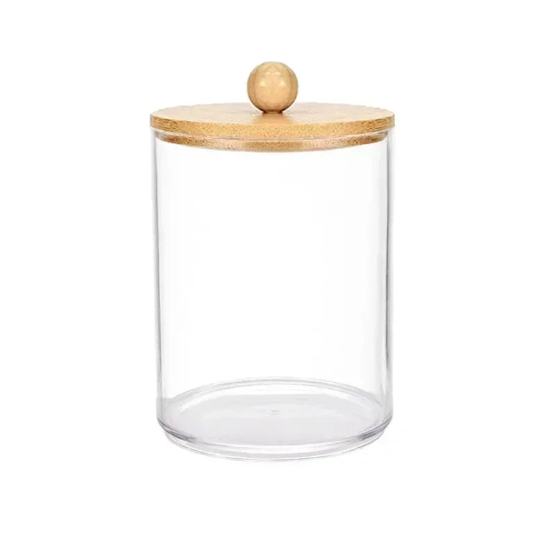 Clear glass apothecary jar storage organizer with a wooden lid