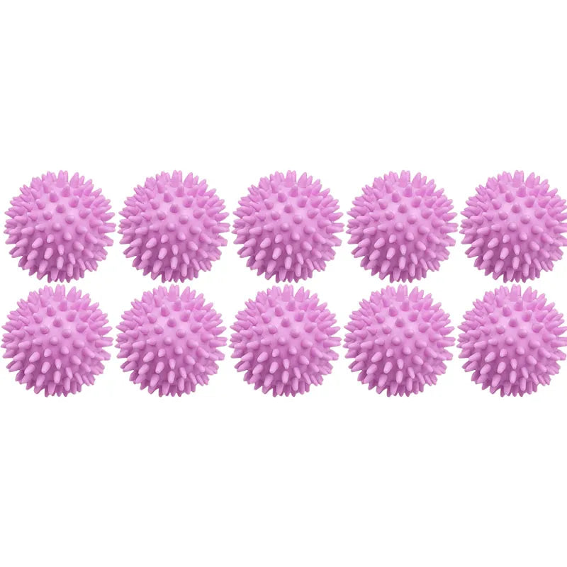 A row of pink reusable laundry balls for clothes and machines.
