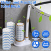 A white disposable toilet brush with a long handle and multiple cleaning bristles is shown next to a toilet.