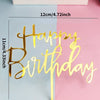 Gold acrylic birthday topper set spelling out Happy Birthday on a light blue and pink background