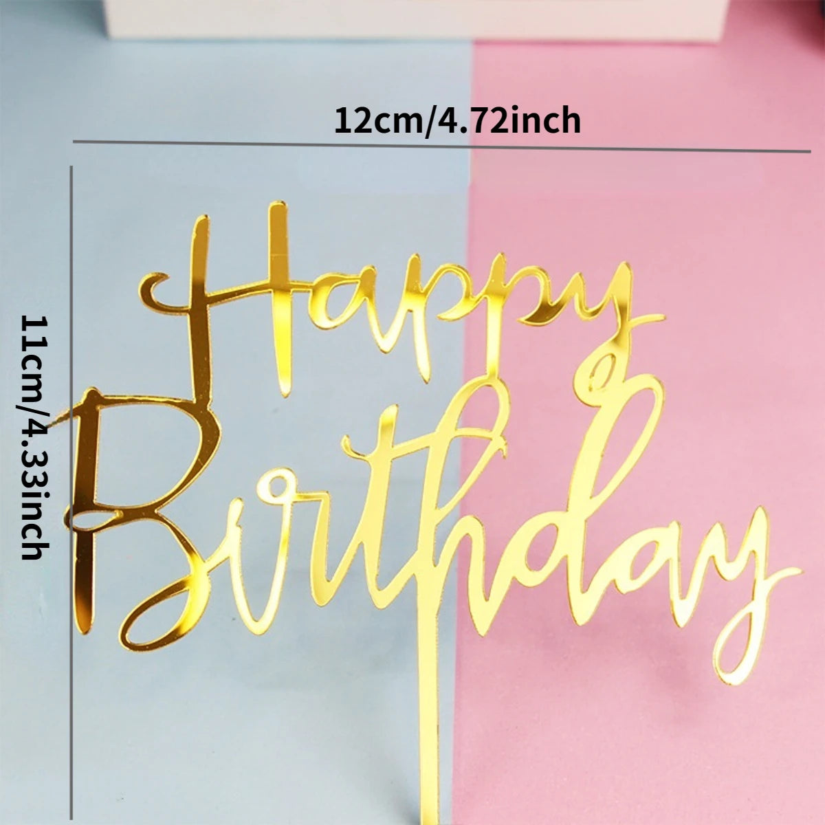 Gold acrylic birthday topper set spelling out Happy Birthday on a light blue and pink background
