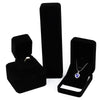 Elegant black velvet jewelry storage box set with a lid and an open display tray