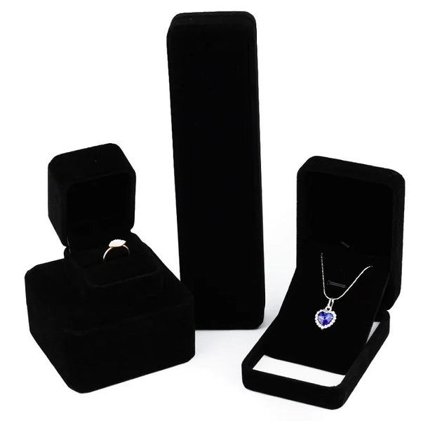 Elegant black velvet jewelry storage box set with a lid and an open display tray