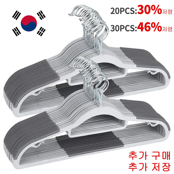 A set of white non-slip heavy-duty plastic hangers with silver swivel hooks shown in various configurations.